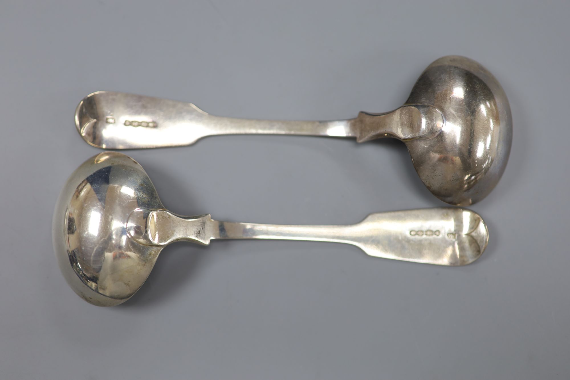 A pair of Victorian silver fiddle pattern sauce ladles, John James Whiting, London, 1838, 4.8oz.